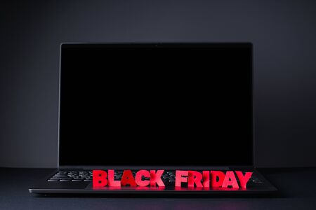 Black friday concept. Laptop on a black background.の写真素材