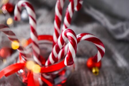 Christmas concept. Christmas composition with sweets and Christmas decorations on grayの写真素材