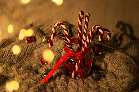 Christmas concept. Christmas composition with sweets and Christmas decorations on a gray plaid.の写真素材