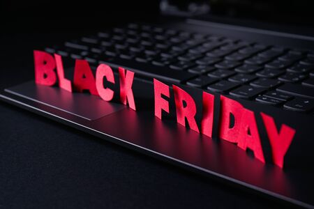 Black friday concept. Laptop on a black background.の写真素材