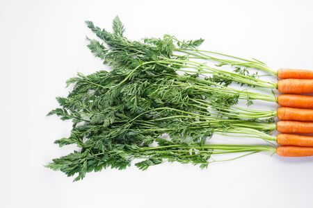 Flat lay composition with ripe fresh carrots on white background