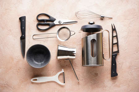 A set of knives. Various kitchen utensils on a gray table background, flat lay, with place for text.の写真素材