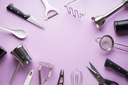 Kitchen utensils with space for text on a purple background. Flat lay.の写真素材