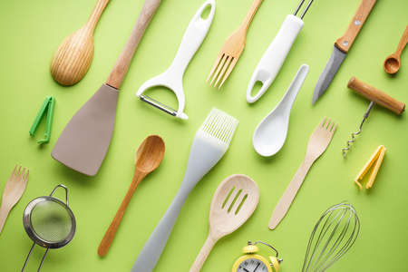 Kitchen utensils on a green background. Flat lay.の写真素材