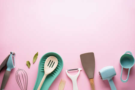 Kitchen utensils with space for text on a pink background. Flat lay.の写真素材