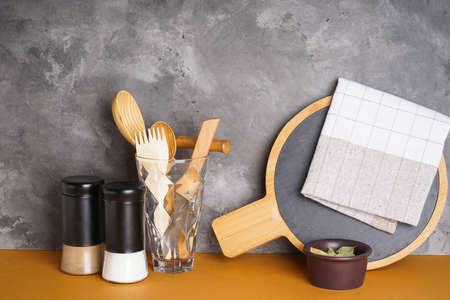 Various kitchen utensils on a gray background.の写真素材