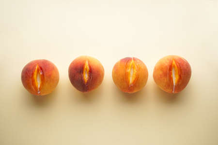Flat lay composition with juicy peaches on an yellow background. Sex conceptの写真素材