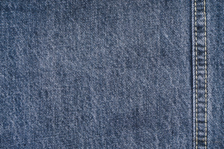 Jeans background, denim with seam of fashion design, space for text. Flat lay