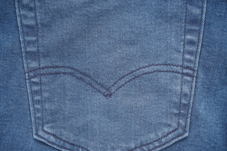 Blue denim back pocket on denim pants.の写真素材
