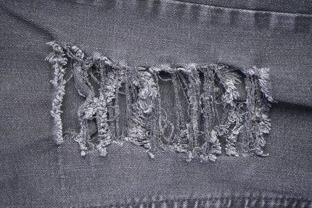 Gray jeans ragged clothing texture. Denim gray