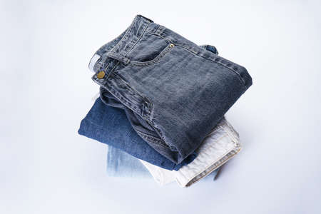 A set of folded jeans isolated on white background