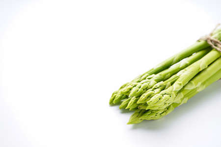 Fresh green asparagus on white background, space for textの写真素材