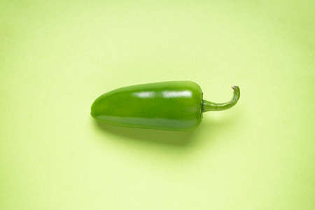 Jalapeno pepper, cut, on a light green background.の写真素材