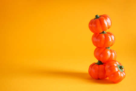 Halloween concept. Halloween pumpkins on yellow background, space for text.の写真素材