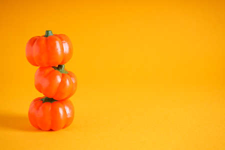 Halloween concept. Halloween pumpkins on yellow background, space for text.の写真素材
