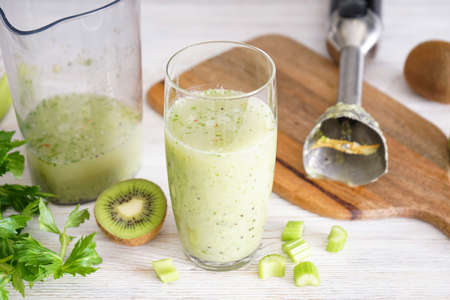 Hand blender for mixing organic raw fresh fruits for making vitamin diet smoothie, healthy food.の写真素材