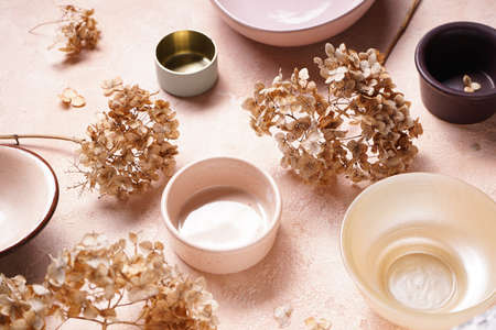 Table setting with hortesia dried flowers. Pastel, natural colors, close-up.の写真素材