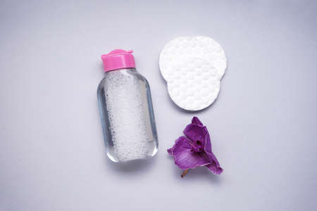 spa concept. Cotton pads and micellar water on a gray background, top view.の写真素材