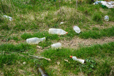 A pile of rubbish in a clearing in the countryside on a spring day, concept of ecology.
