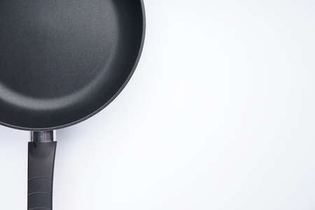 New frying pan on white background, space for text, top view.の写真素材