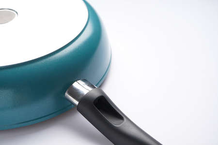 New frying pan on white background, space for text, back view.の写真素材