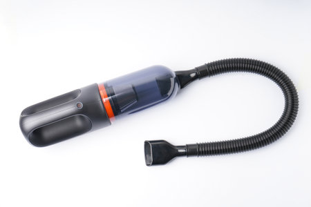 The cordless car vacuum cleaner on a white background.の写真素材