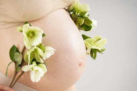 Pregnant woman with flowersの写真素材
