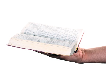Praying hand hold an open bibleの写真素材