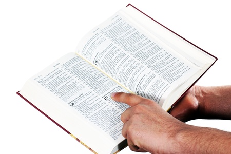 Praying hand hold an open bibleの写真素材