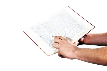 Praying hand hold an open bibleの写真素材