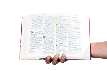 Praying hand hold an open bibleの写真素材
