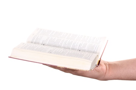 Praying hand hold an open bibleの写真素材