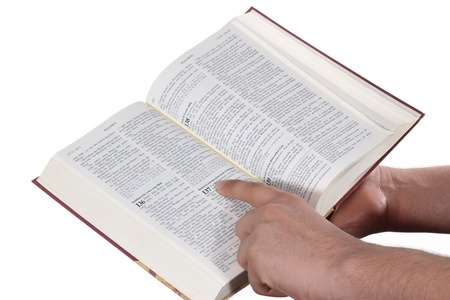 Praying hand hold an open bibleの写真素材
