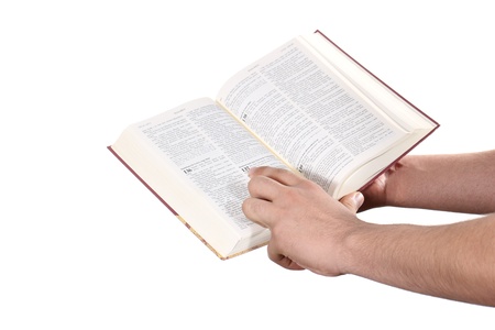 Praying hand hold an open bibleの写真素材