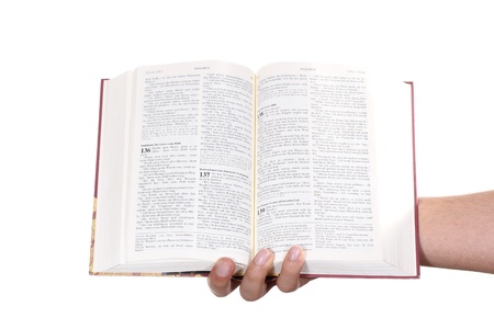 Praying hand hold an open bibleの写真素材