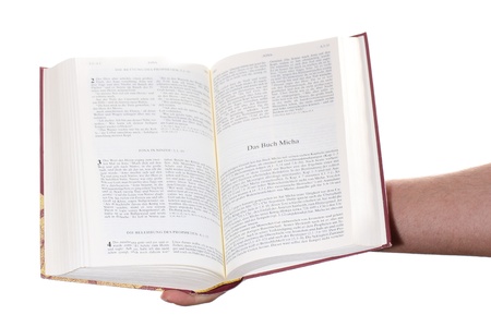Praying hand hold an open bibleの写真素材