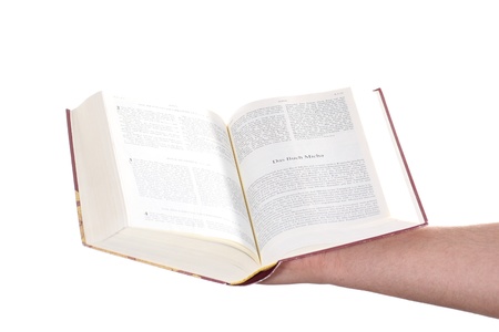 Praying hand hold an open bibleの写真素材