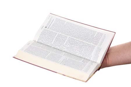 Praying hand hold an open bibleの写真素材