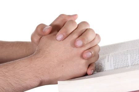 Praying hand hold an open bibleの写真素材