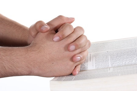 Praying hand hold an open bibleの写真素材