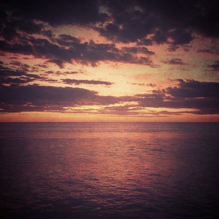 Sunset over waterの写真素材