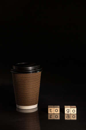 Coffee To Go with black background and letteringの写真素材