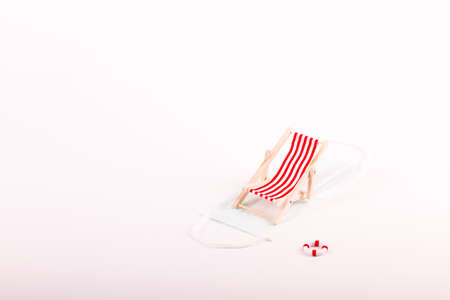 Beach chairs isolated on a  face mask and white backgroundの写真素材
