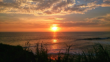 Beautiful Sunset at the ocean beachの写真素材