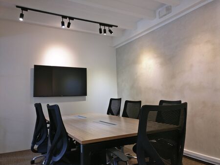 this is photo of interior design of meeting rooms with black chairs and screens with best quality and high resolution for you.の写真素材