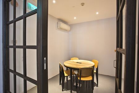 this is photo of interior design with black tables and windows with white roof with white walls with...