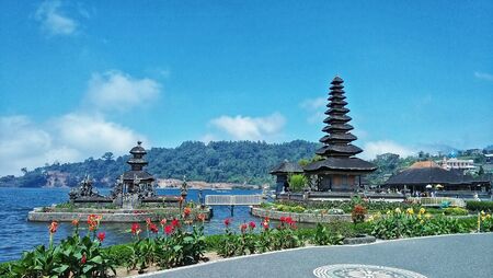 Temple with lake and hillの写真素材