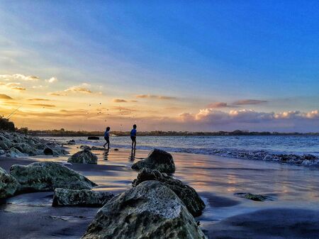 the beach with stones and clear skyの写真素材