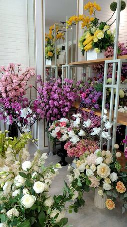 lots of colorful flowers neatly arranged in potsの写真素材