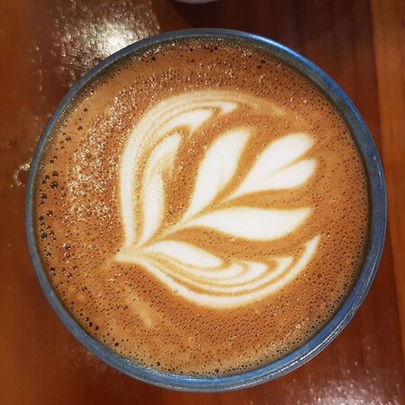 cappuccino coffee with a unique shape in the middle in a cupの写真素材